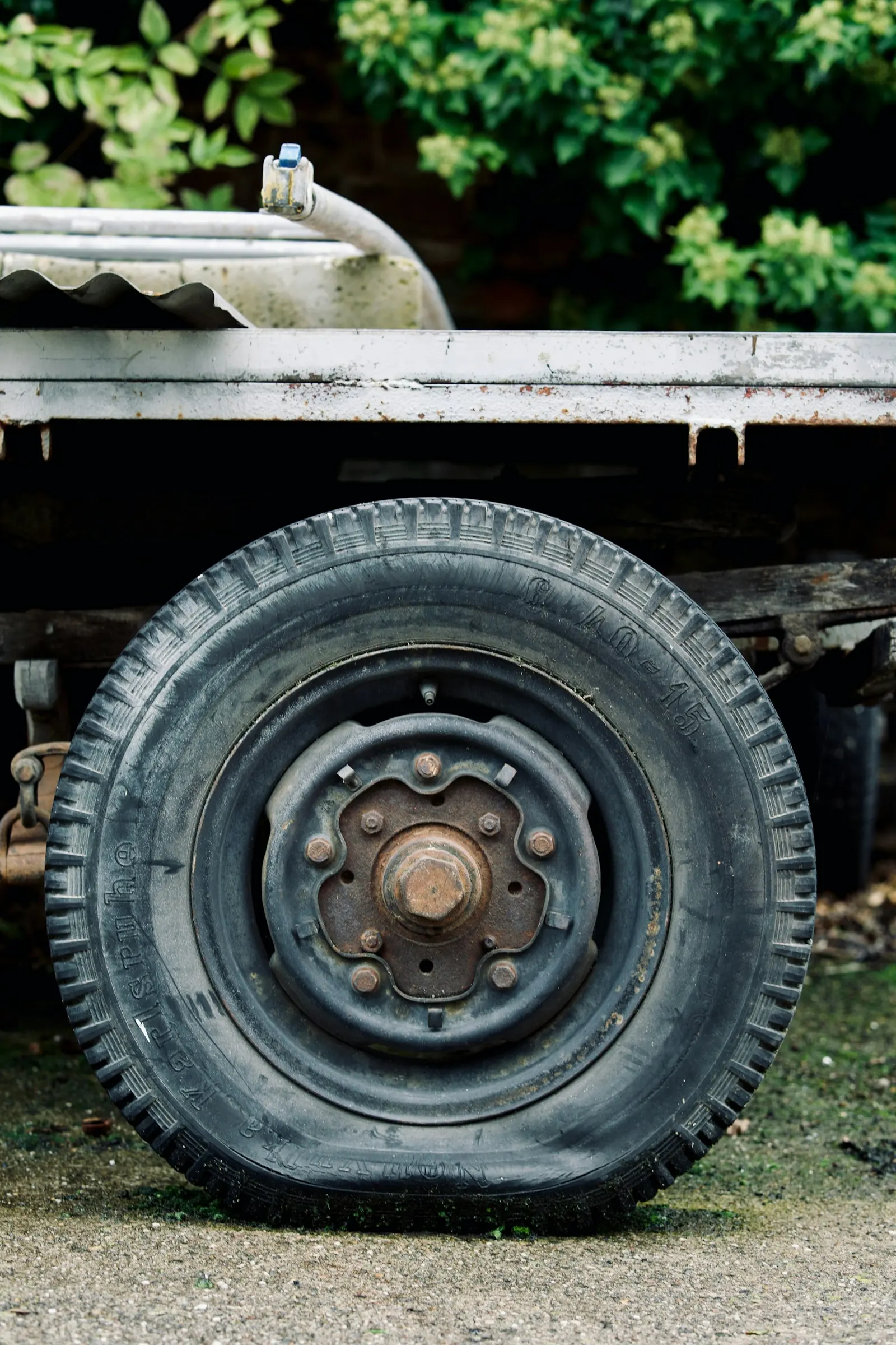 Lug wrench on a Jeep wheel during a roadside tire change