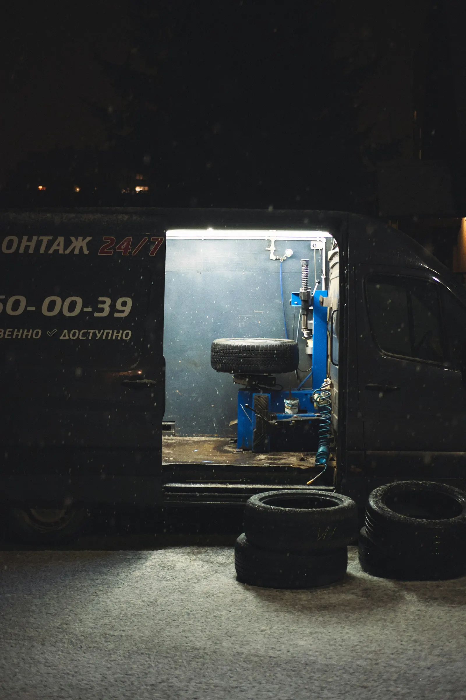 Mobile tire service van with equipment at night